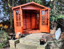 Traditional varnished double-doored summer house/shed with doors open